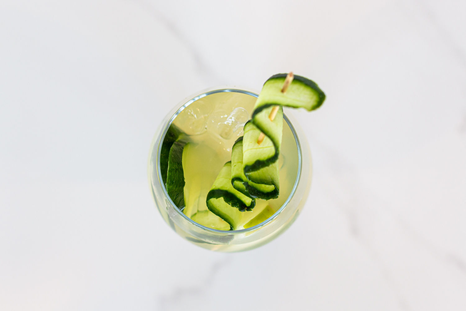 on the green cocktail with cucumber, juno gin and apple juice.